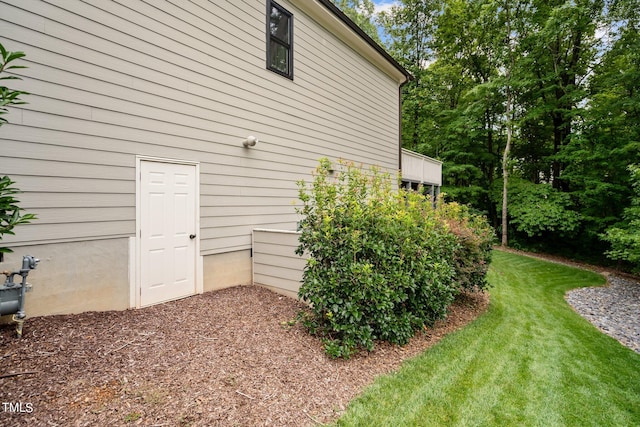 view of home's exterior featuring a yard