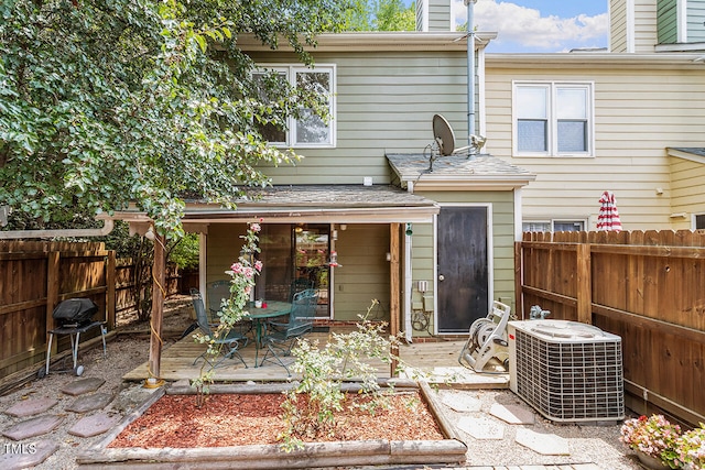 back of house with central air condition unit and a patio