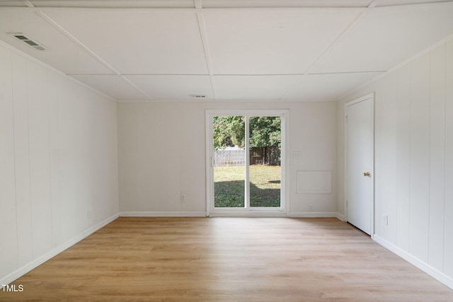 unfurnished room with light hardwood / wood-style flooring