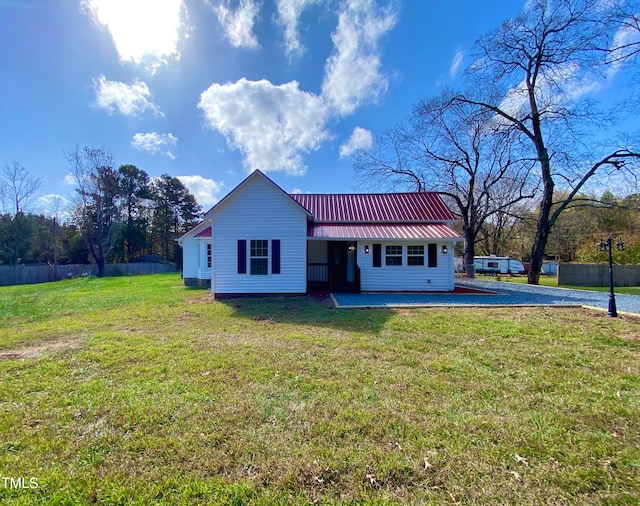 ranch-style house featuring a patio and a front lawn