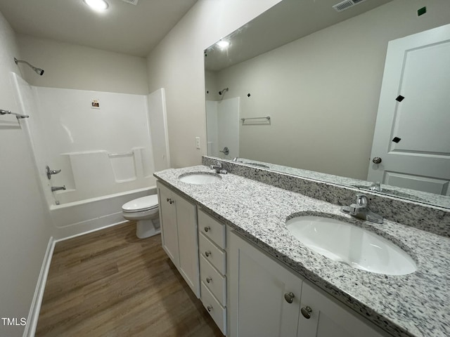 108 Pate Landing Dr, Selma, NC 27576 - bathroom with shower / bathtub combination, a sink, toilet, and wood finished floors