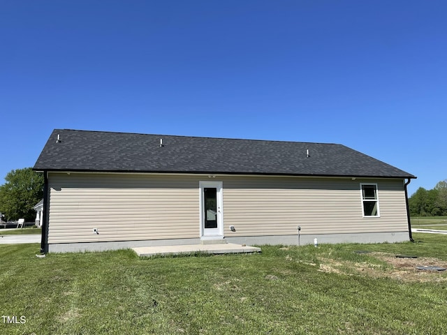 108 Pate Landing Dr, Selma, NC 27576 - rear view of house featuring a patio, a yard, and roof with shingles