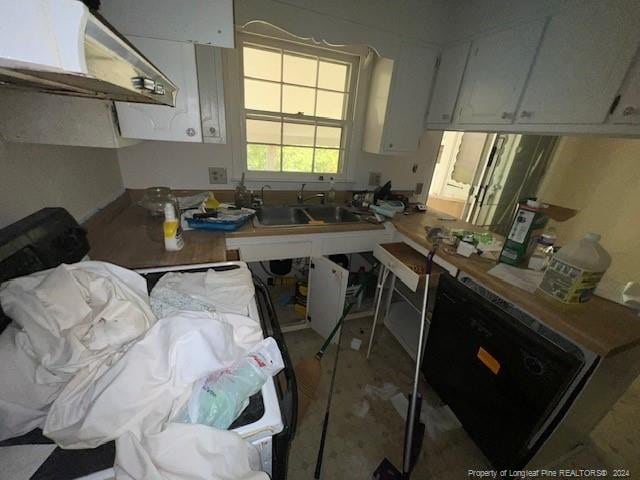 kitchen with white cabinets, black dishwasher, and sink