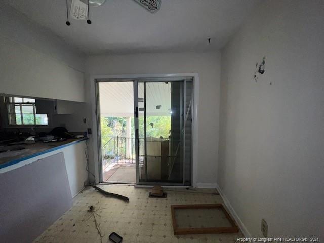 kitchen with ceiling fan and a wealth of natural light