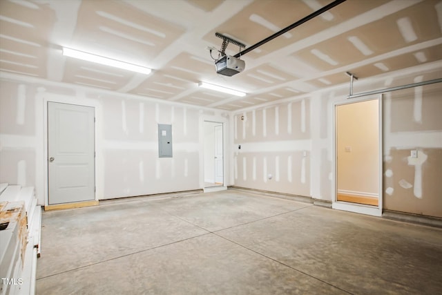 garage featuring a garage door opener and electric panel