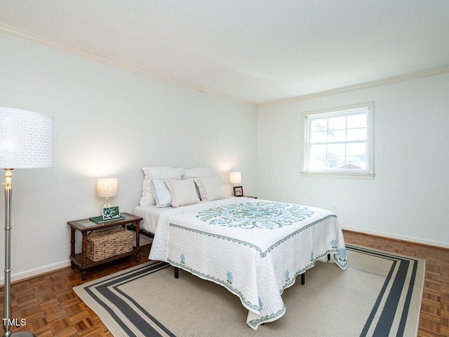 bedroom with ornamental molding and dark parquet flooring