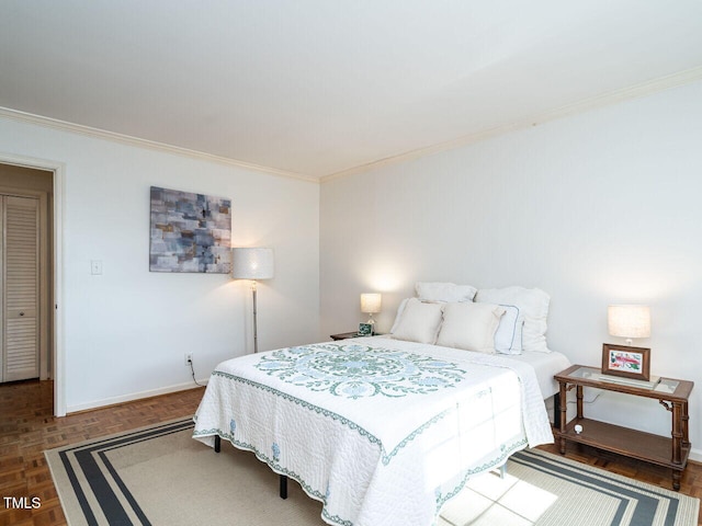 bedroom with baseboards and ornamental molding