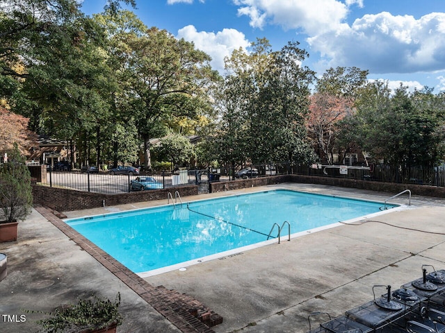 view of pool featuring a patio area