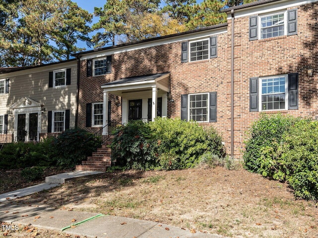 view of front of house featuring brick siding