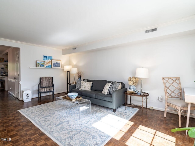 living room with ornamental molding, baseboards, and visible vents