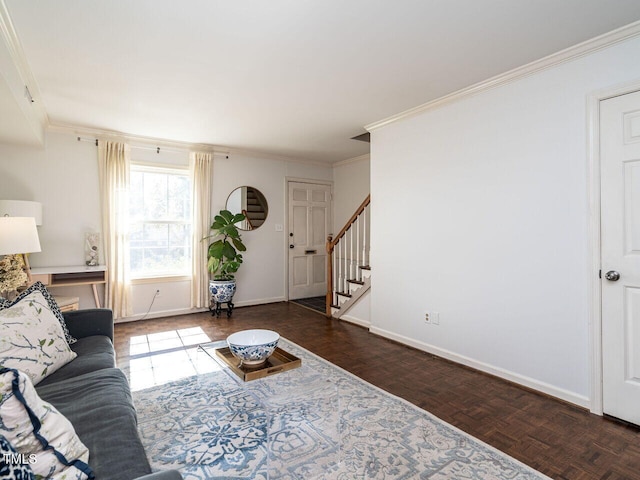 living room featuring ornamental molding, stairs, and baseboards