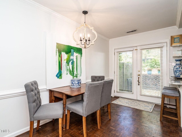 dining area featuring ornamental molding, french doors, a notable chandelier, and dark parquet floors