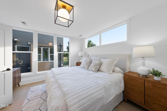 bedroom with light hardwood / wood-style flooring