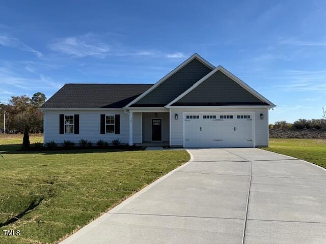 view of front facade with a garage and a front yard