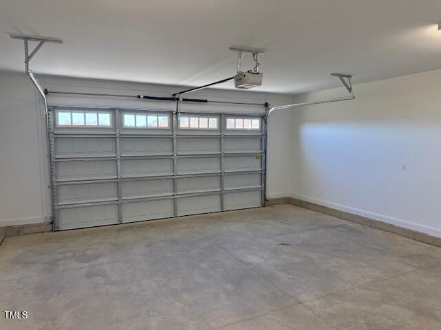 garage featuring a garage door opener