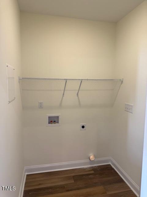 laundry area with hookup for an electric dryer, dark wood-type flooring, and hookup for a washing machine