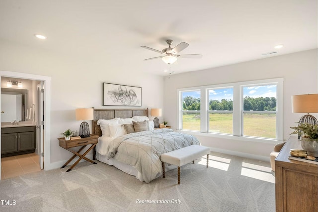 bedroom featuring baseboards, light carpet, recessed lighting, and visible vents