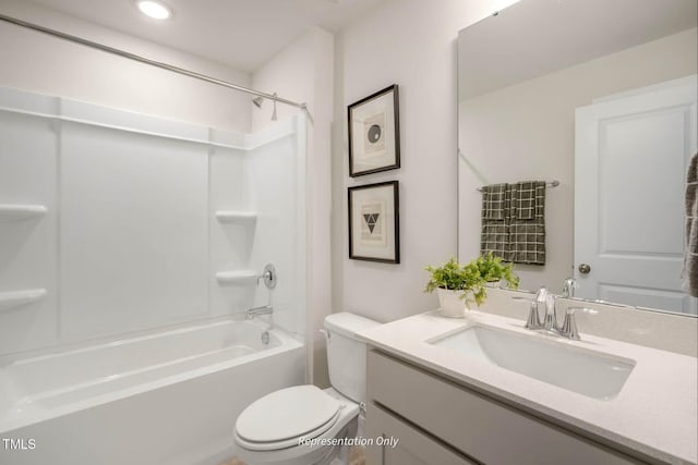 bathroom featuring vanity, shower / bathtub combination, and toilet
