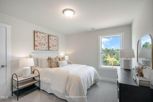 bedroom featuring visible vents, baseboards, and carpet floors
