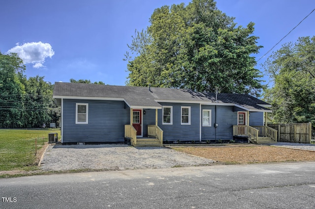 ranch-style house featuring central air condition unit