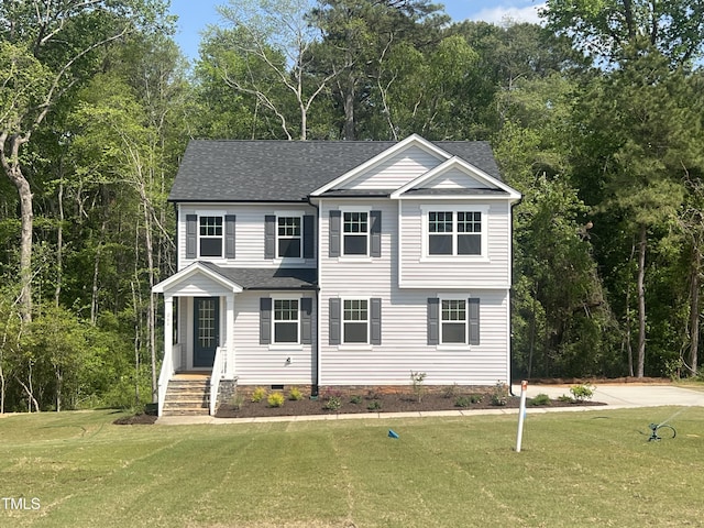 view of front of home featuring roof with shingles, crawl space, and a front yard