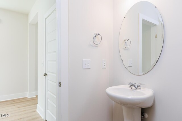 240 Fast Pitch Ln, Four Oaks, NC 27524 - bathroom with a sink, wood finished floors, and baseboards