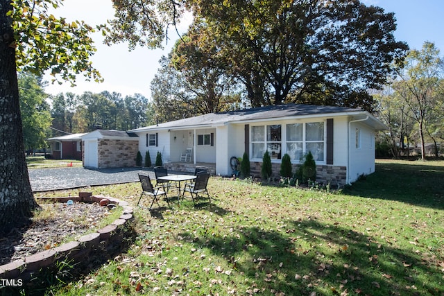 back of property featuring a yard and a patio area