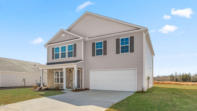 view of front facade featuring a front yard and a garage