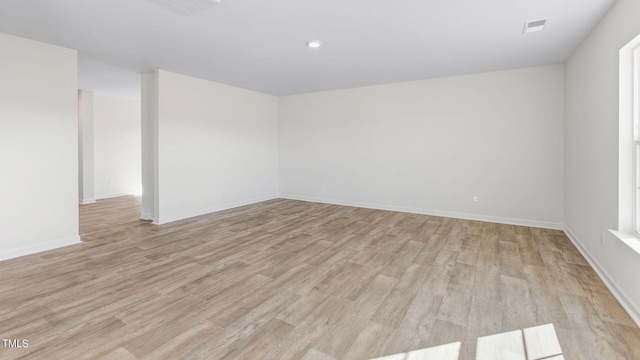 unfurnished room featuring light hardwood / wood-style floors