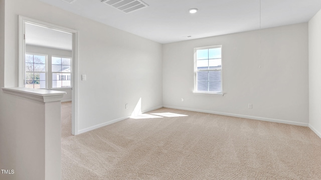 unfurnished room with light carpet