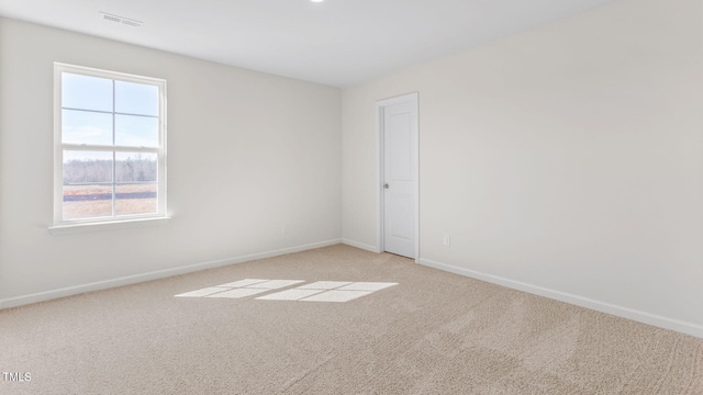 empty room with light colored carpet