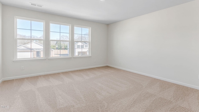 unfurnished room with light colored carpet