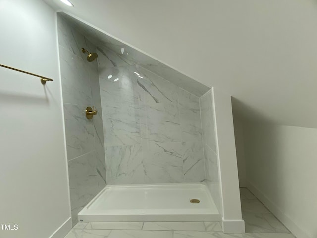 bathroom with a tile shower