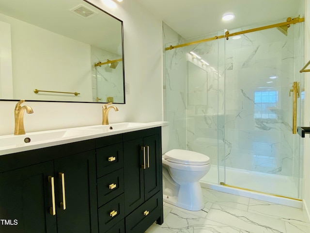 bathroom featuring vanity, toilet, and an enclosed shower