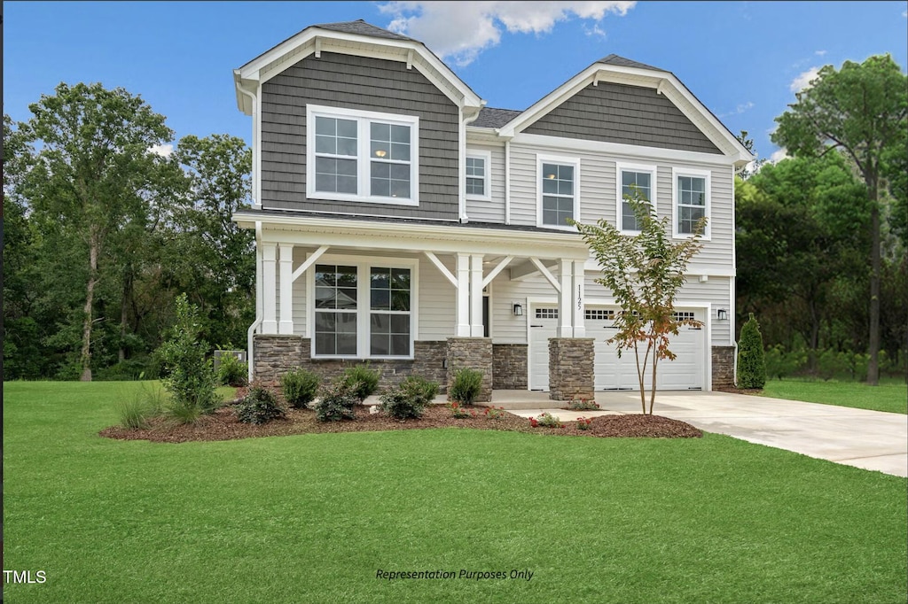 craftsman-style home featuring a front yard, covered porch, and a garage