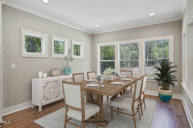 dining room featuring crown molding and dark hardwood / wood-style flooring