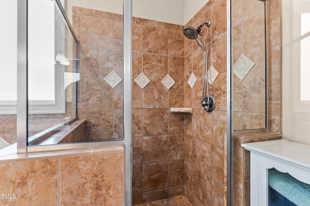 bathroom with a tile shower