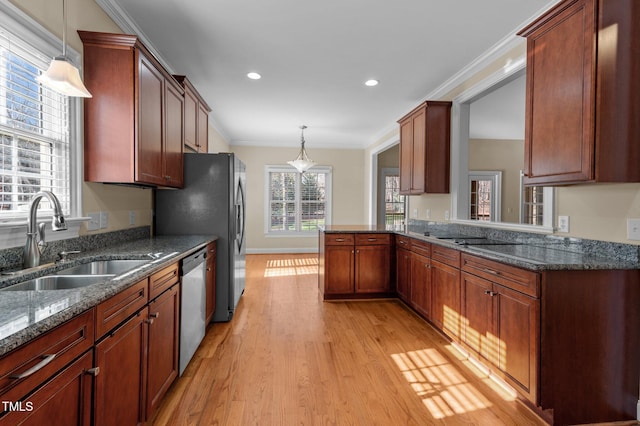 kitchen featuring dishwasher, crown molding, sink, and hanging light fixtures