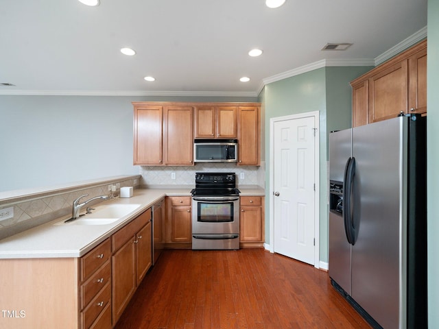 kitchen featuring sink, tasteful backsplash, dark hardwood / wood-style floors, crown molding, and appliances with stainless steel finishes