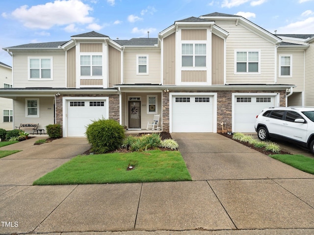 multi unit property featuring a porch and a garage