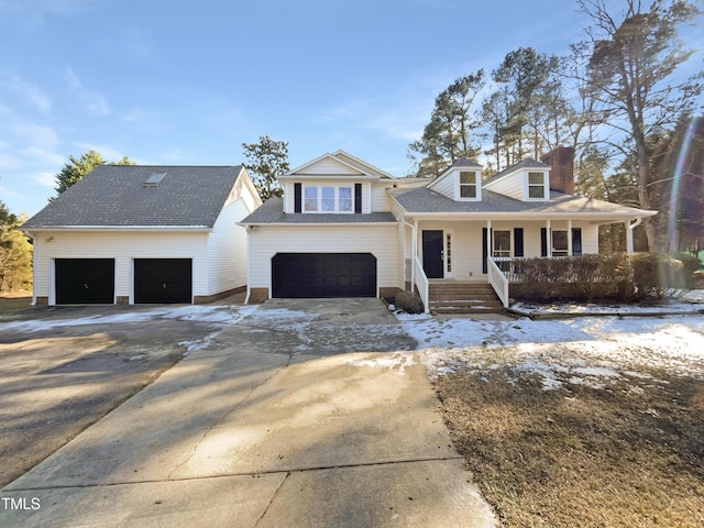 view of front facade featuring a porch and a garage