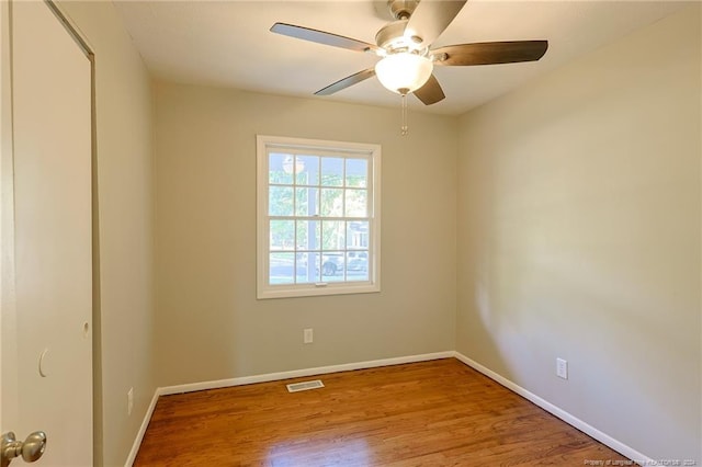 unfurnished room with light wood-type flooring and ceiling fan