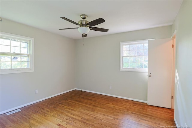 empty room featuring light hardwood / wood-style flooring and ceiling fan