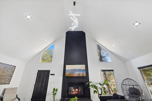 interior space with a fireplace and an inviting chandelier