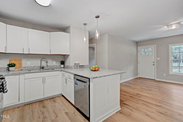 kitchen featuring white cabinetry, light stone countertops, light hardwood / wood-style flooring, dishwasher, and sink