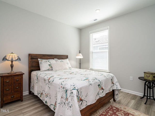 bedroom with wood-type flooring