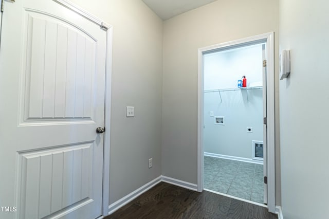 laundry area featuring electric dryer hookup, dark hardwood / wood-style floors, and hookup for a washing machine