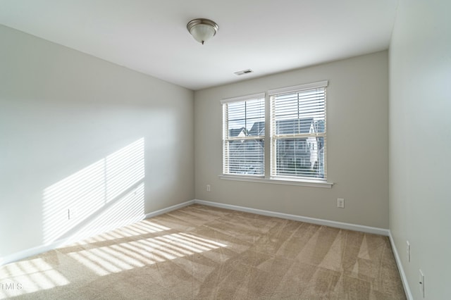 empty room with light colored carpet