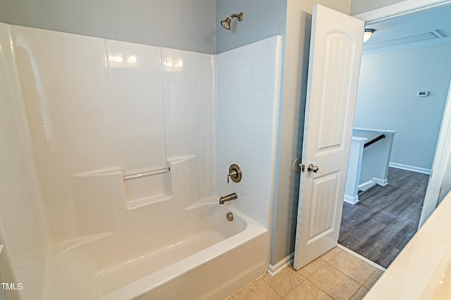 bathroom featuring bathing tub / shower combination and tile patterned floors