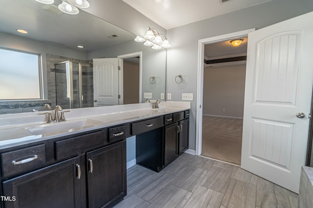 bathroom with vanity and an enclosed shower